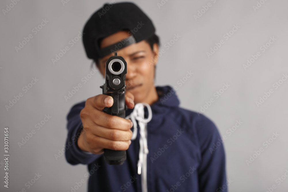 Young woman dressed like a gangster with pistol. Young woman dressed like a gangster with pistol.