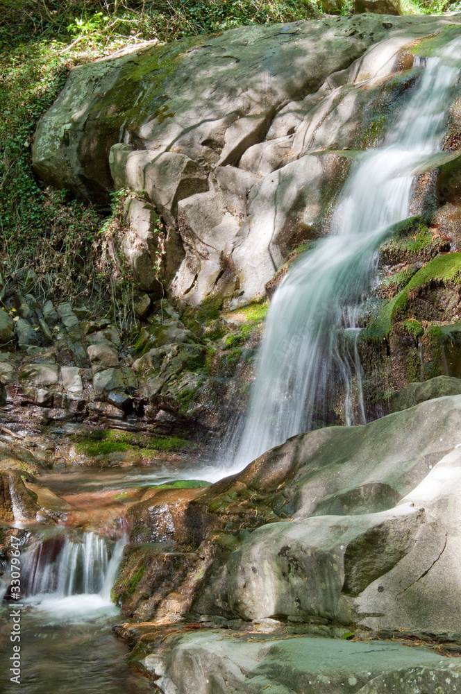 springtime waterfall in woods of Tuscany springtime waterfall in woods of Tuscany