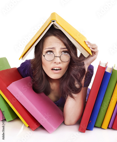 Girl with stack color book . photo