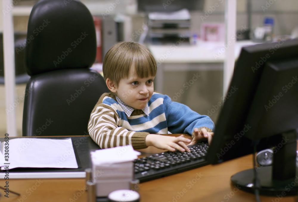 child using a computer at daddy's office child using a computer at daddy's office