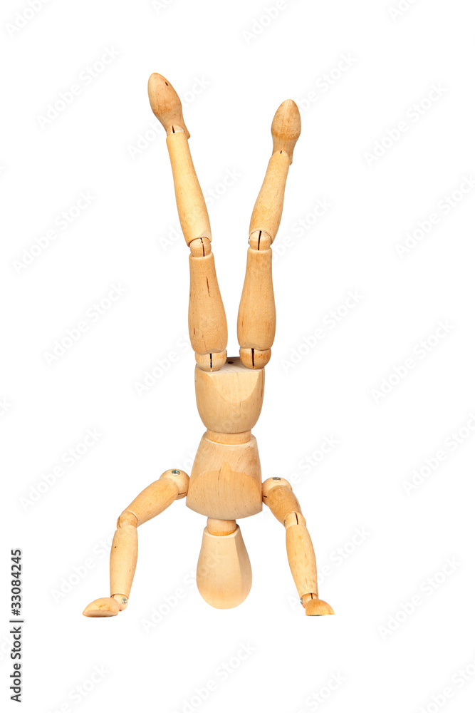Jointed wooden mannequin doing handstands Jointed wooden mannequin doing handstands