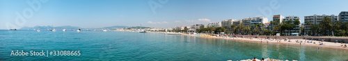 Sunshine beach and turquoise water in Cannes, France. © lexan