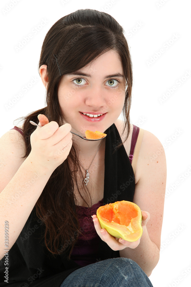Attractive Young Woman Eating Papaya Fruit Attractive Young Woman Eating Papaya Fruit