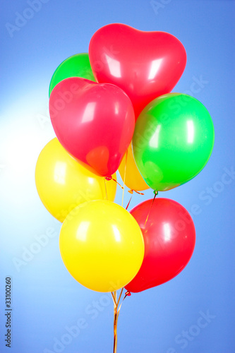 Flying balloons on a blue background