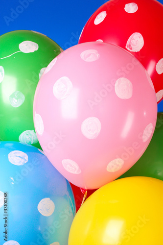 Flying balloons with polka dot on a blue background