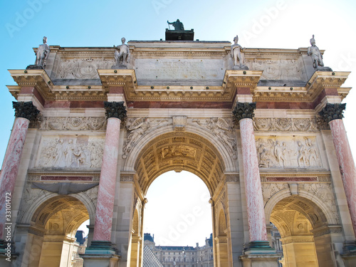 behind of Arc de Triomphe du Carrousel with Louvre museum photo