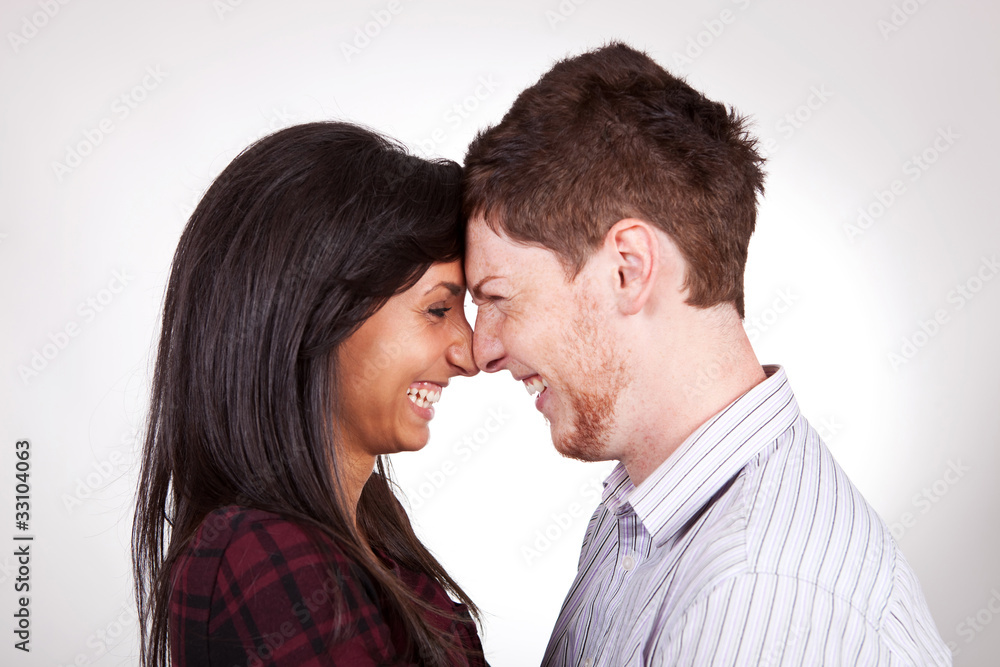 head to head couple laughing