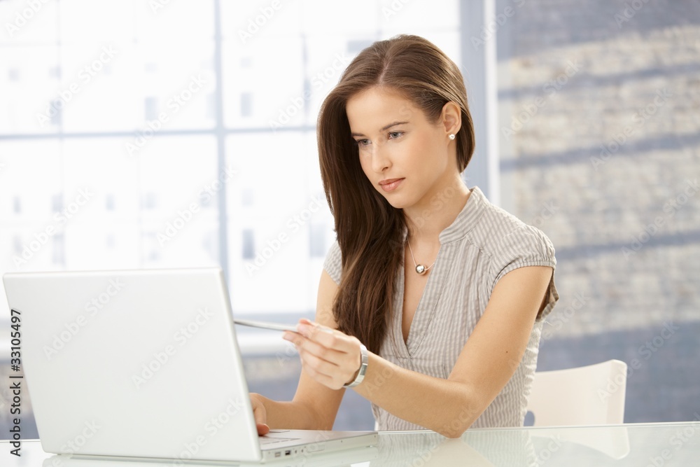 Office worker girl reading on screen Office worker girl reading on screen