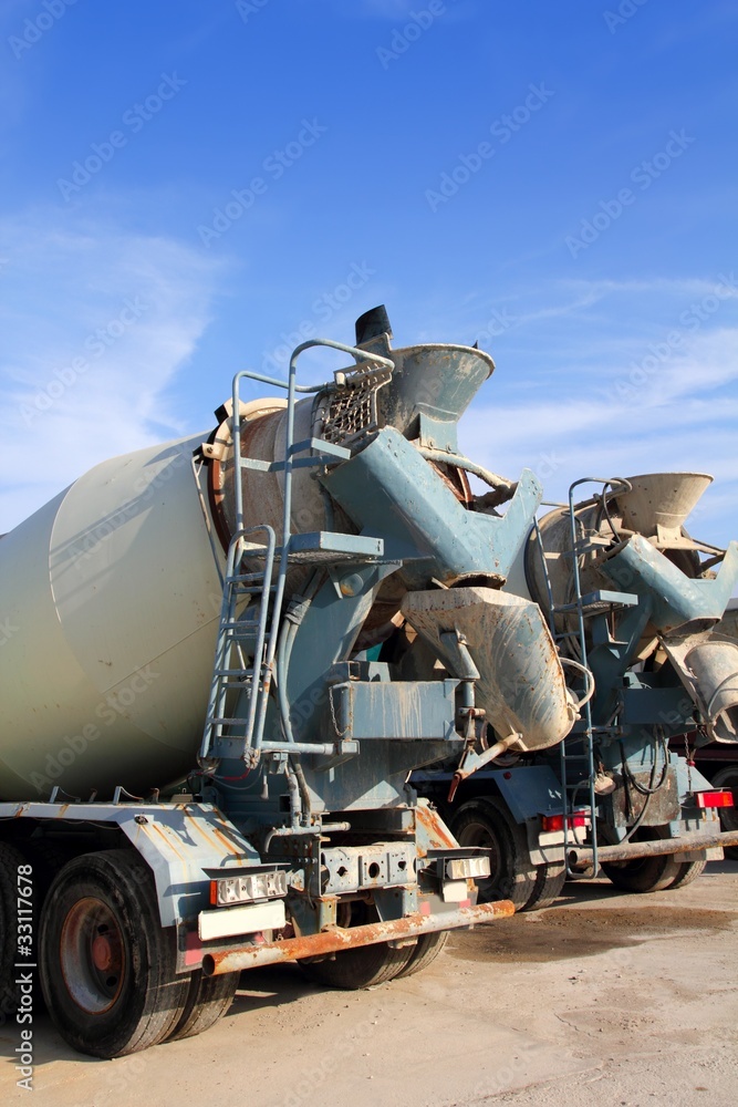 concrete mixer two trucks rear view grunge