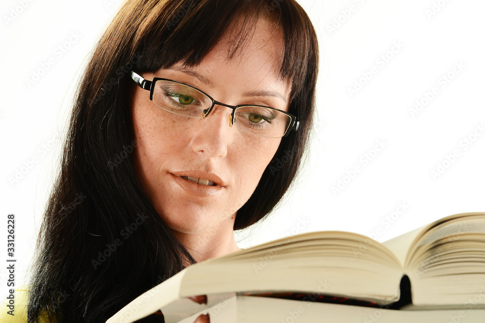 Young woman reading a book isolated on white Young woman reading a book isolated on white