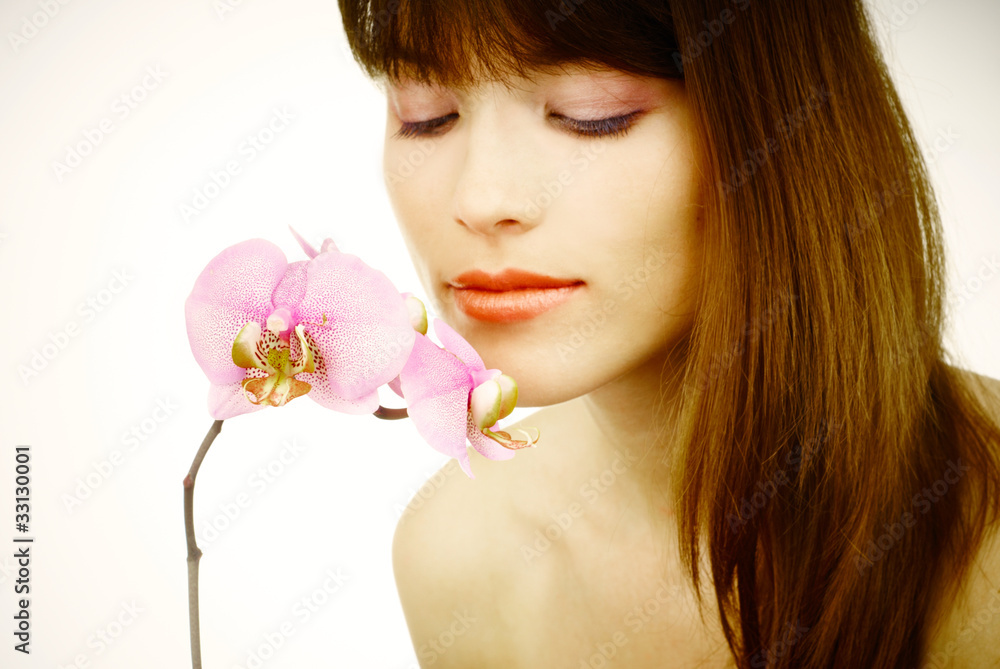 portrait of a woman with a pink orchid