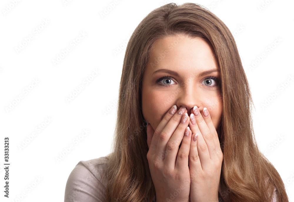 Portrait of a surprised young woman with hands over her mouth la Portrait of a surprised young woman with hands over her mouth la