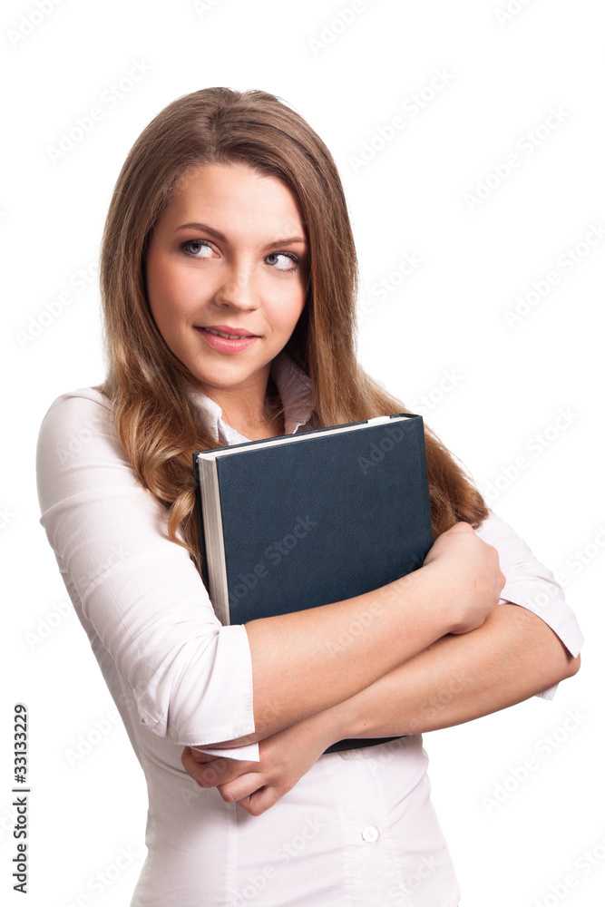 Attractive woman smiling while holding book Attractive woman smiling while holding book