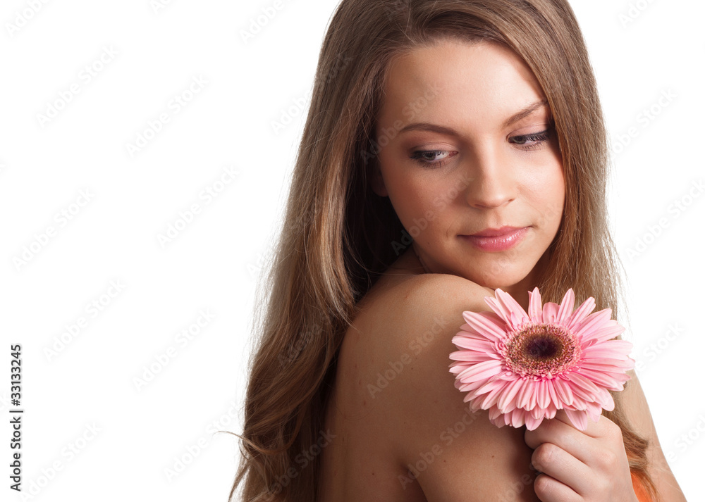 closeup of a pretty young woman smelling a pink flower closeup of a pretty young woman smelling a pink flower