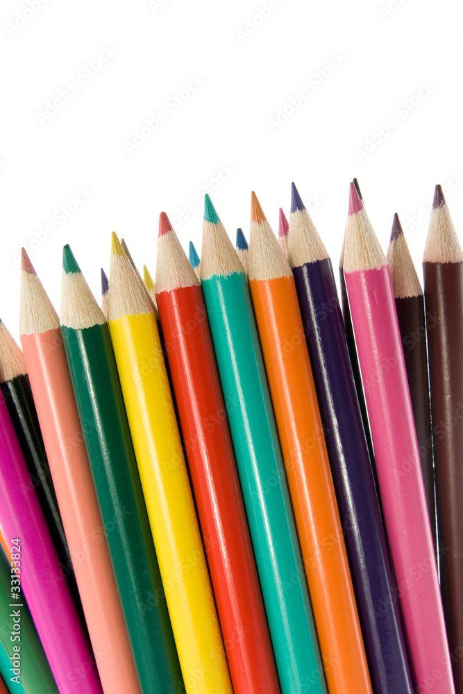 close up of color pencils over a white background. close up of color pencils over a white background.