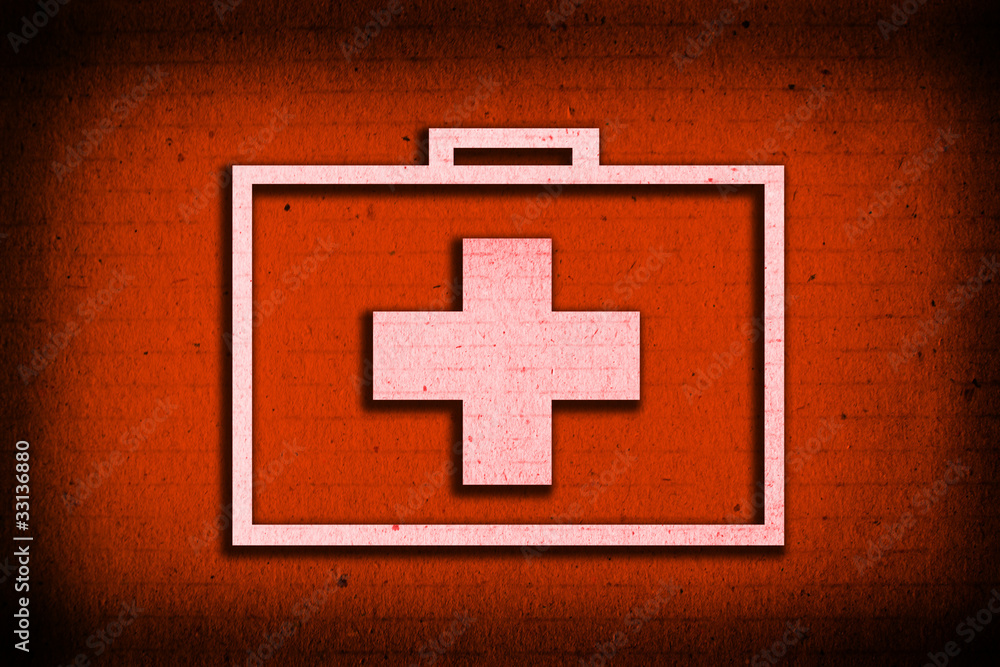 Fototapeta premium Suitcase for healing symbol on red paper background
