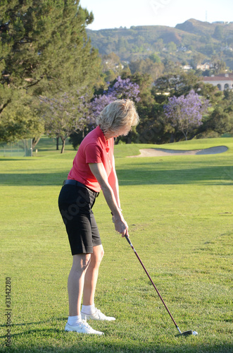 Mature Woman Playing Golf
