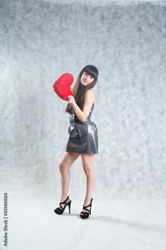 Beautiful Young Woman Holding Red Heart