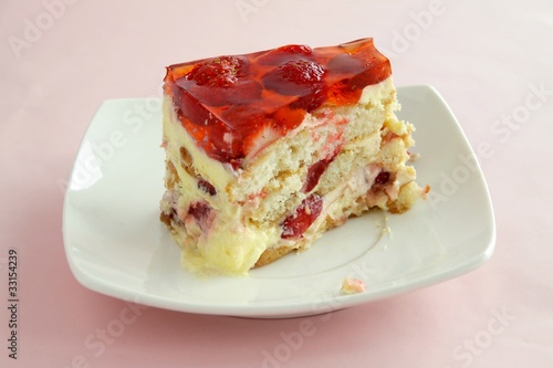 homemade fruit-cake with jelly,mass,bisquits and strawberries