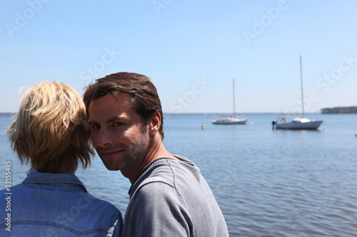 Couple next to a lake