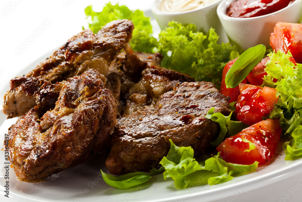 Grilled steaks and vegetables