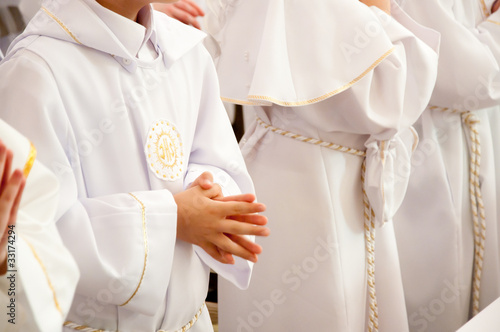 children accepting the first Holy Communion