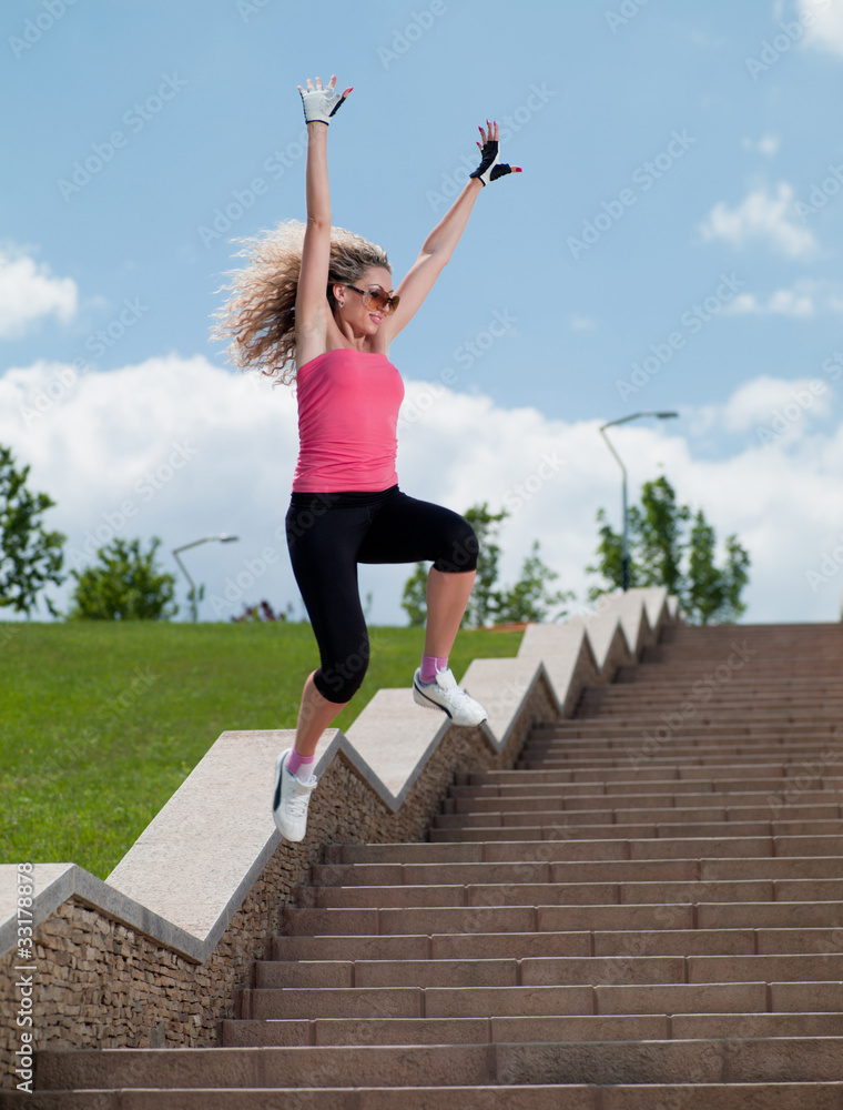 Woman in sportswear jumping