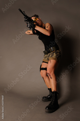 Woman with weapon. photo