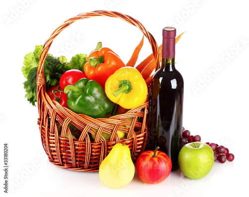 A set of vegetables in wricker basket isolated on white photo