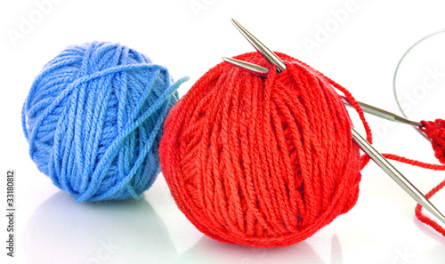 Knitting yarn and knitting needles on white