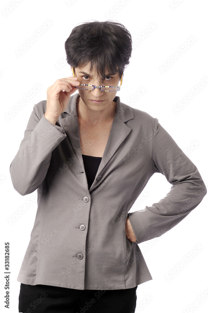 mature business woman looking over her glasses mature business woman looking over her glasses