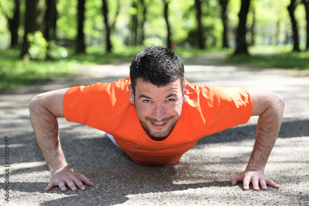 man doing exercice in a park in summer man doing exercice in a park in summer