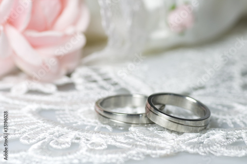 Wedding rings on romantic background