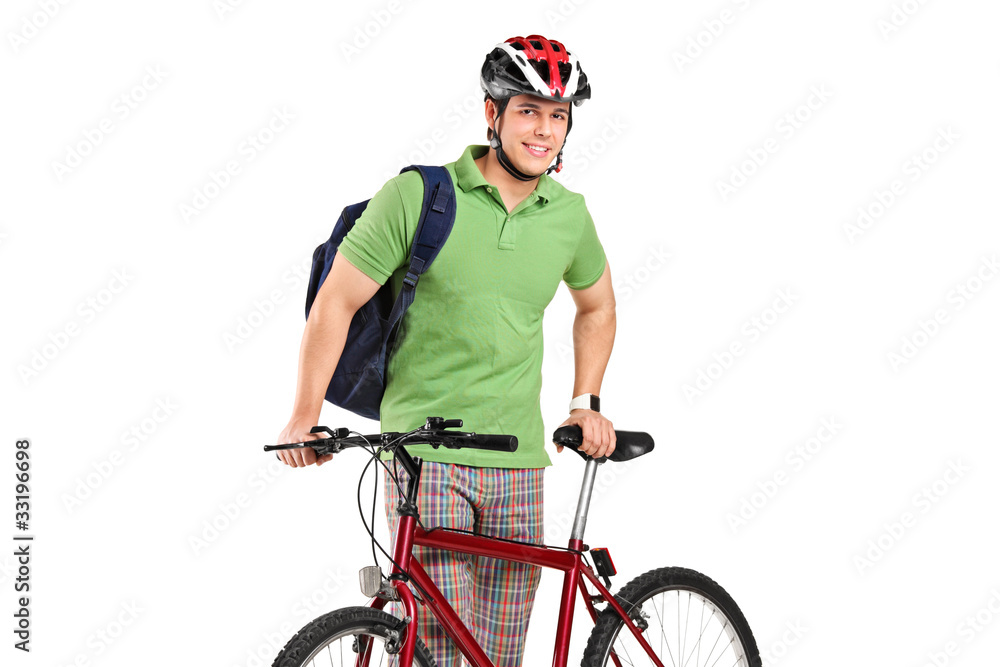 Fototapeta premium Young bicyclist posing next to a bicycle