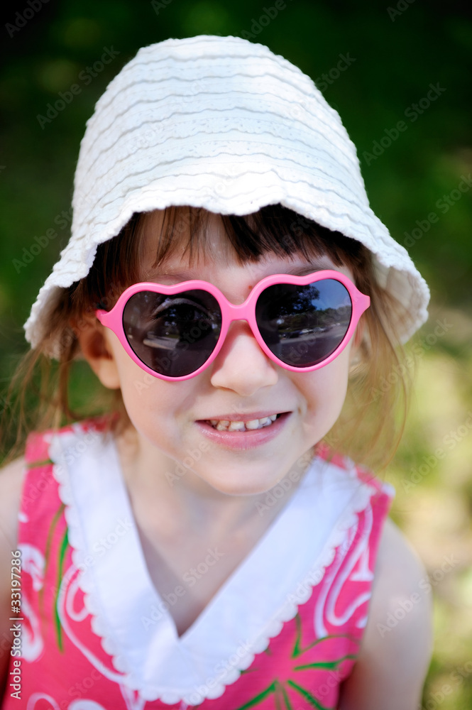 Cute little girl in pink sun glasses Cute little girl in pink sun glasses