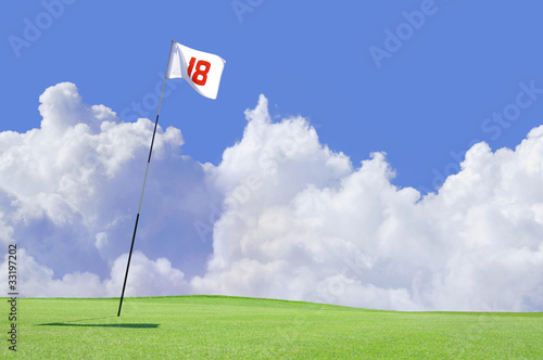 golf course flag at hole 18 putting green photo