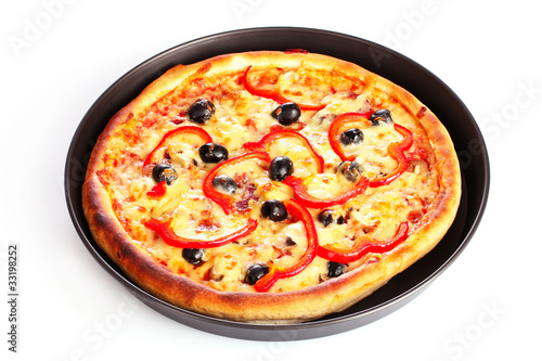pizza in pan isolated on white