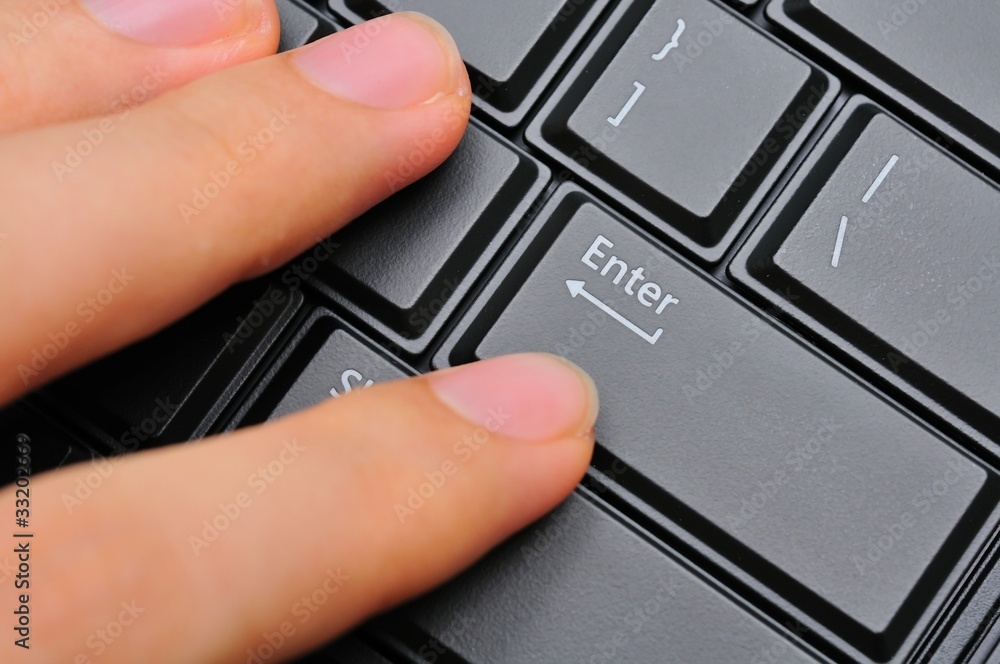 Fingers pressing on Enter Fingers pressing on Enter