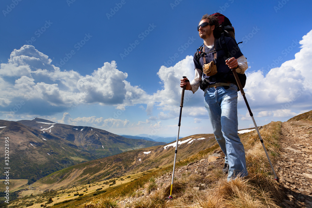 sportive man on the mountain trek