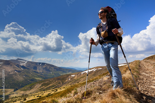 sportive man on the mountain trek