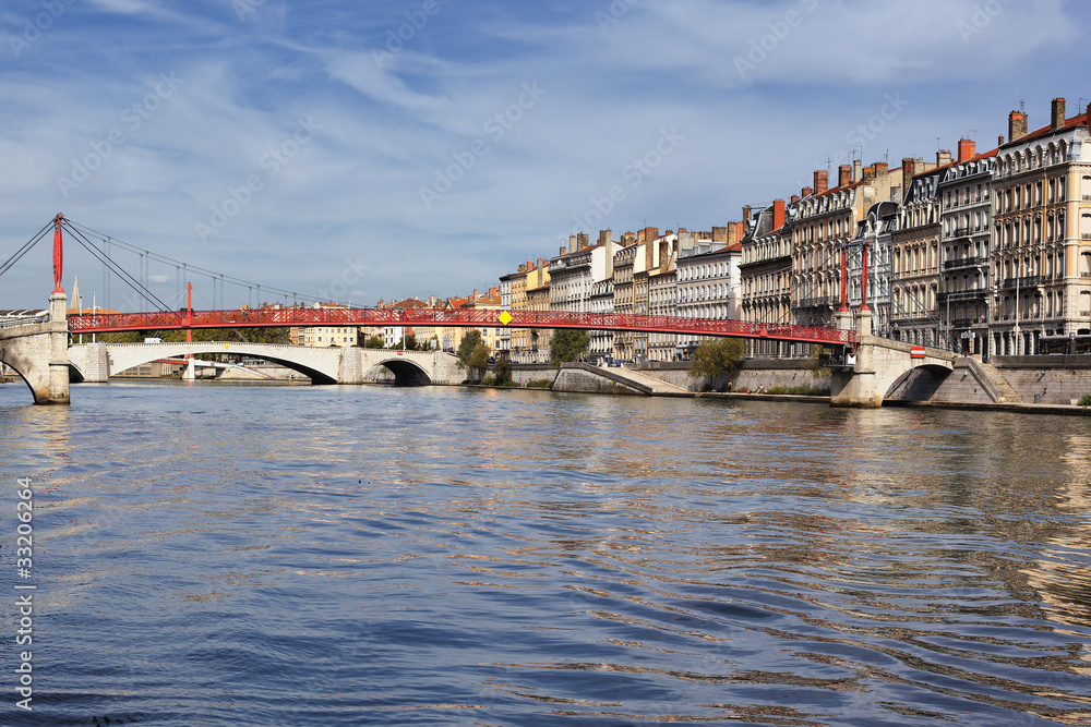 Lyon city with red footbridge in summer