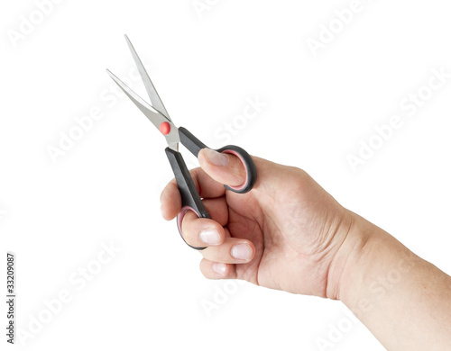 hand holding scissors