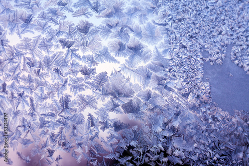 Frosty natural pattern at a winter window glass