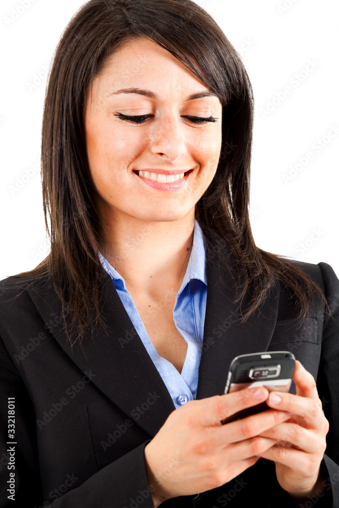 Beautiful girl texting a sms on cell phone Beautiful girl texting a sms on cell phone
