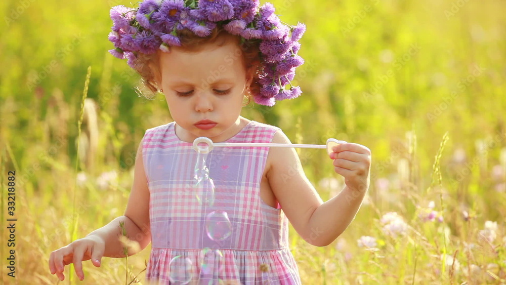 Child with boubles in the meadow Child with boubles in the meadow