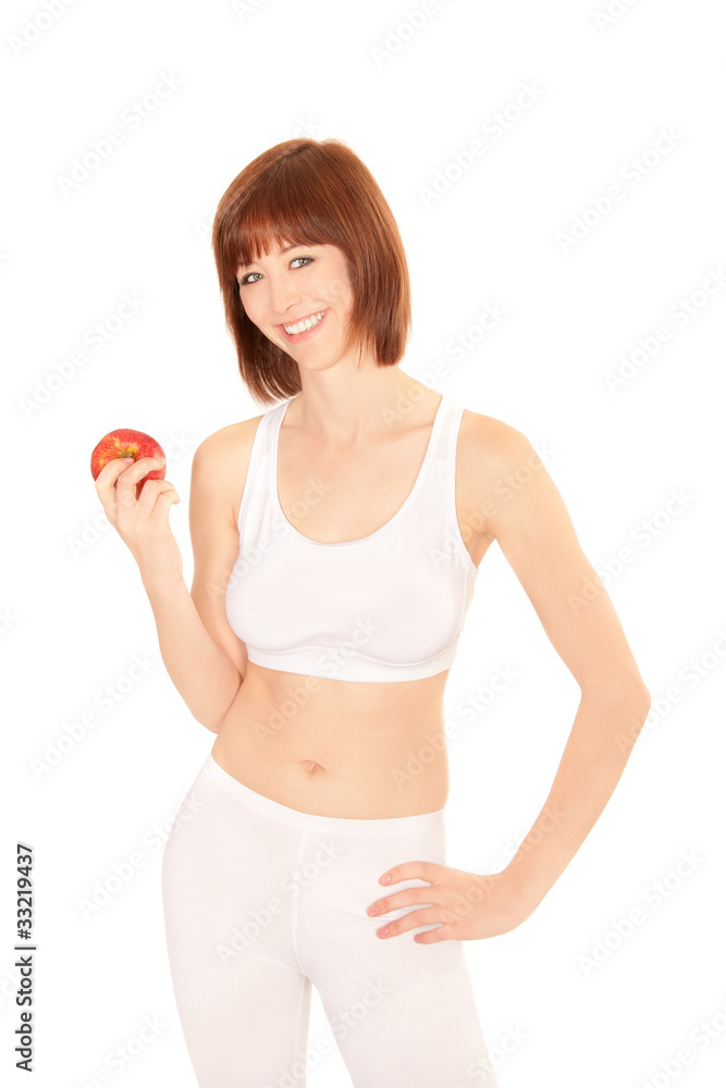 Portrait einer lachenden jungen Frau mit Apfel in der Hand Portrait einer lachenden jungen Frau mit Apfel in der Hand