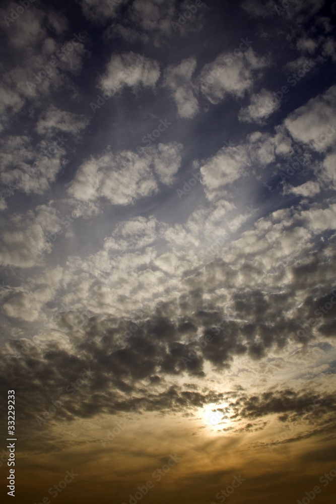 Vertical photo of the cloudscape background at the sunset