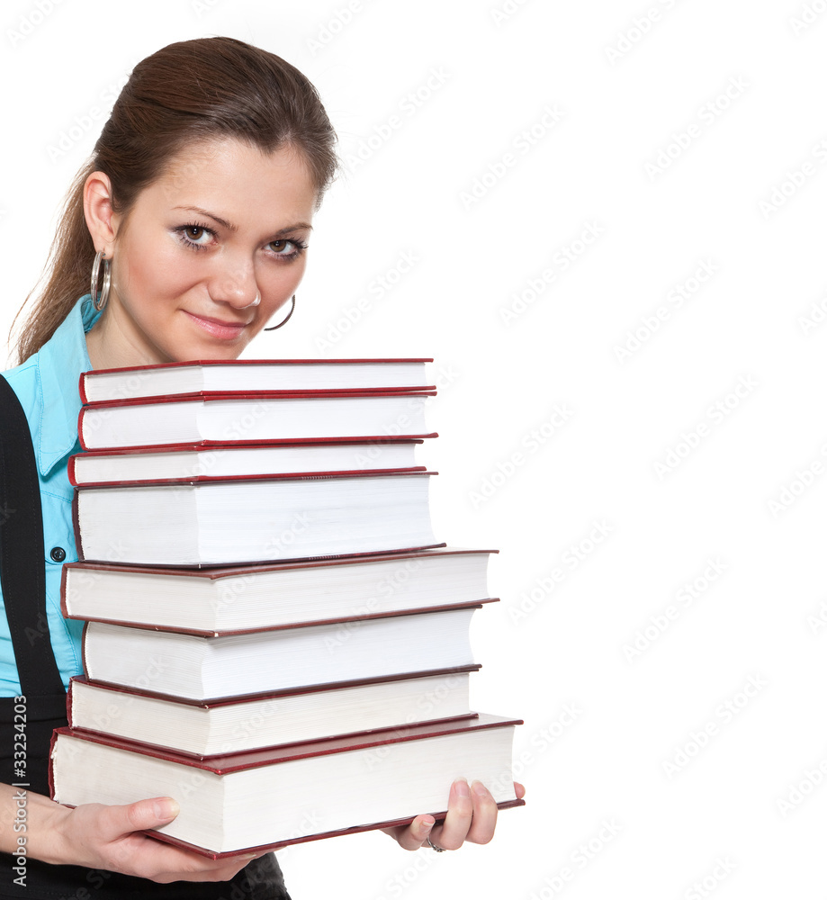 Beautiful student is holding a lot of books Beautiful student is holding a lot of books