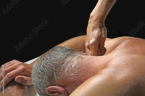 Therapist applying pressure to client s neck