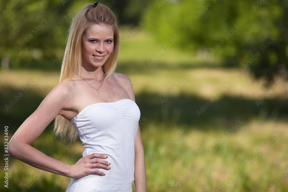 Beautiful young blonde woman in park Beautiful young blonde woman in park